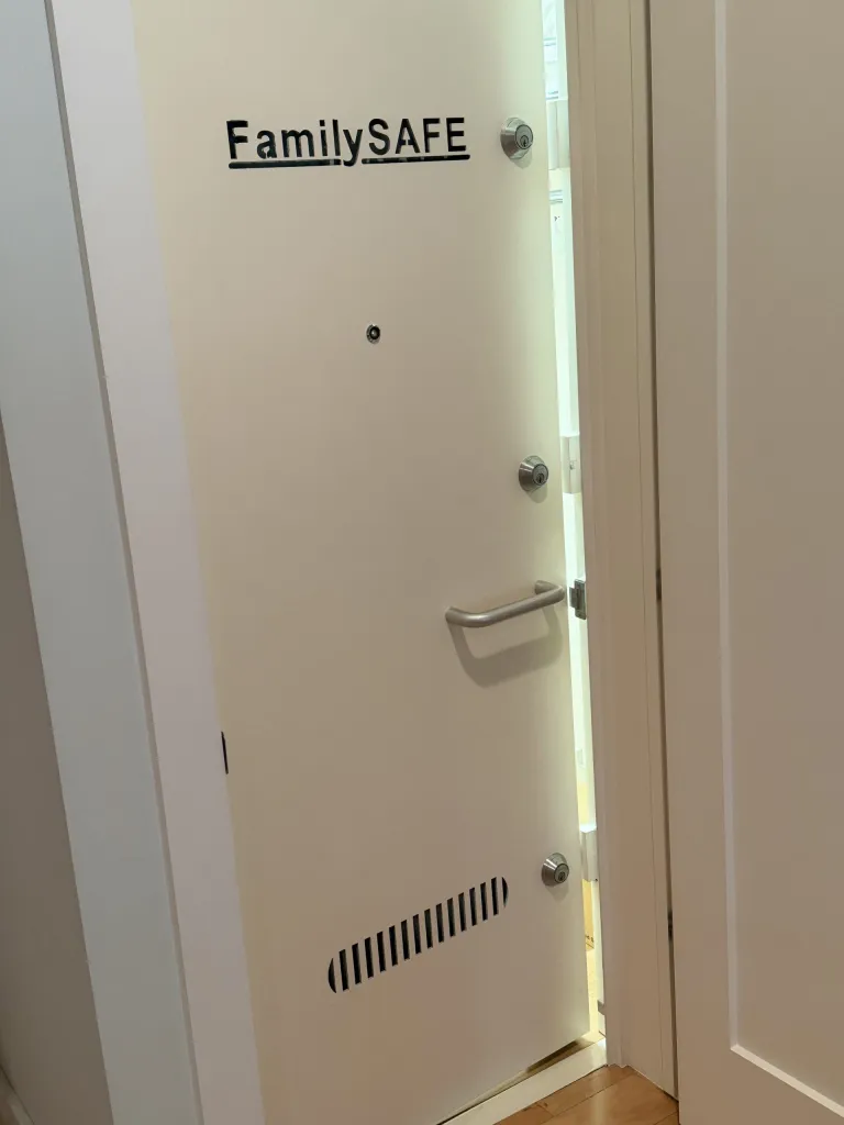 Storm shelter door with a FamilySAFE nameplate